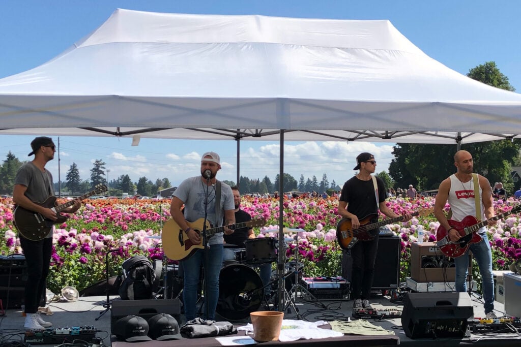 Nate Botsford performing on the outdoor stage at the Annual Dahlia Festival.